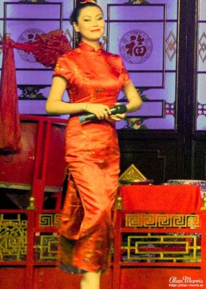 Beautiful compere introduces the Sichuan Opera & Folk Art show.