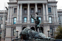 The Closing Era statue in front of the Denver State Capitol building.