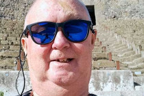 Alan Morris stood in a theatre at Pompeii.