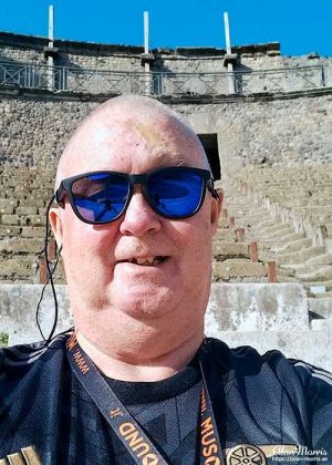 Alan Morris stood in a theatre at Pompeii.