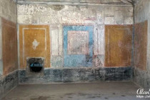 Colourful walls of a home in Pompeii.