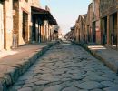 Long cobble stone paved road in Pompeii.