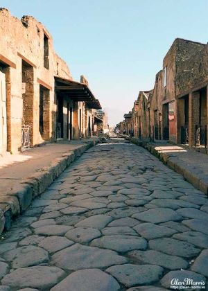 Long cobble stone paved road in Pompeii.