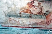 A mural above a door to a room in a Lupinare