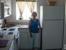 Jean Morris in the Kitchen of Alans' apartment at the Villages of Seaport.