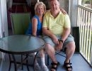 Jean & Alan Morris on the balcony of his apartment in The Villages of Seaport.