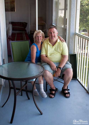 Jean & Alan Morris on the balcony of his apartment in The Villages of Seaport.