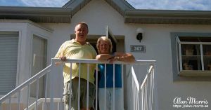 Jean & Alan Morris outside Alan's apartment in The Villages of Seaport.