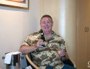 Alan Morris drinking Champagne in the cabin on the Queen Mary II.