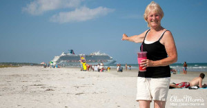 Jean Morris pointing at The Carnival Dream cruise ship leaving Port Canaveral, Florida.