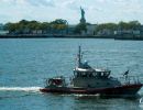 Coastguard alongside the Queen Mary II as we sail out of New York.