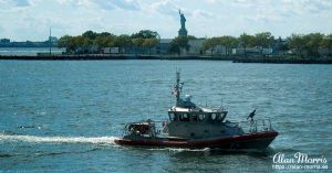 Coastguard alongside the Queen Mary II as we sail out of New York.