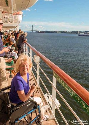 Jean Morris sat in her wheelchair on the deck of The Queen Mary II as it left New York.