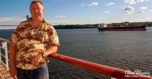 Alan Morris on the deck of the Queen Mary II as it leaves New York.