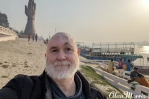 Alan Morris stood next to the River Ganges at Varanasi.