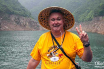 Alan Morris on a small boat that he sailed up the Shennong Stream on.