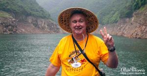 Alan Morris on a small boat that he sailed up the Shennong Stream on.