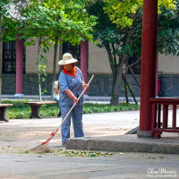 Groundskeeper sweeping leaves at the Small Wild Goose Pagoda Groundskeeper sweeping leaves at the Small Wild Goose Pagoda