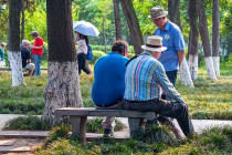 People resting on a bench at the Small wild Goose Pagoda.