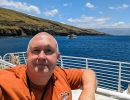 Alan Morris on deck of a boat, Maui, Hawaii.