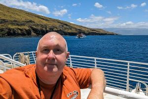 Alan Morris on deck of a boat, Maui, Hawaii.