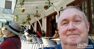 Alan Morris sitting at a cafe just outside the Casbah