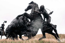 Bronze statue of a Lakota Indian hunting a bison at Tatanka, Story of the Bison.