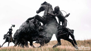 Bronze statue of a Lakota Indian hunting a bison at Tatanka, Story of the Bison.