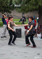 Girls dancing to music in the Temple of Heaven. Girls dancing to music in the Temple of Heaven.