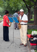 Two saxophonists playing music in the Temple of Heaven. Two saxophonists playing music in the Temple of Heaven.