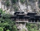 A wooden path follows the cliff face & leads to the Tribe of the 3 Gorges.