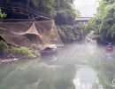 Mist hovers over the Xiangxi River in the Xiling Gorge