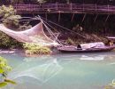 Fishing nets hang between fishing boats on the Xiangxi River in the Xiling Gorge.