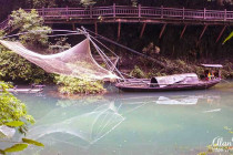 Fishing nets hang between fishing boats on the Xiangxi River in the Xiling Gorge.