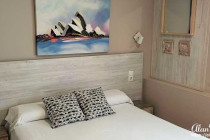 Bed & painting in my hotel room at the Dormavalencia Hotel in Valencia.