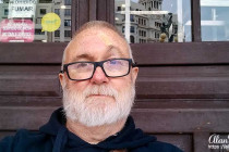 Alan Morris sat outside Valencia train station.