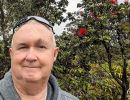 Alan Morris in front of a flowering shrub by the Steam vents near the Kilauea Visitor Centre.