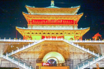 Watchtower on top of the wall around Xi´an lit up at night.
