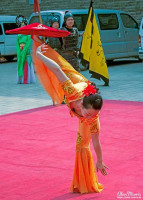 Acrobat performing a tumbling routine at Xián City. Acrobat performing a tumbling routine at Xián City.