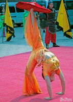 Acrobat performing a tumbling routine at Xián City Walls. Acrobat performing a tumbling routine at Xián City Walls.