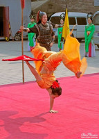 Acrobat performing a balance routine. Acrobat performing a balance routine.