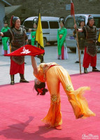 Acrobat performing a balance routine. Acrobat performing a balance routine.
