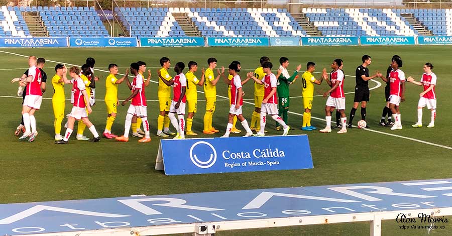 Arsenal & Villa Real teams shake hands before the game at Pinatar Arena.